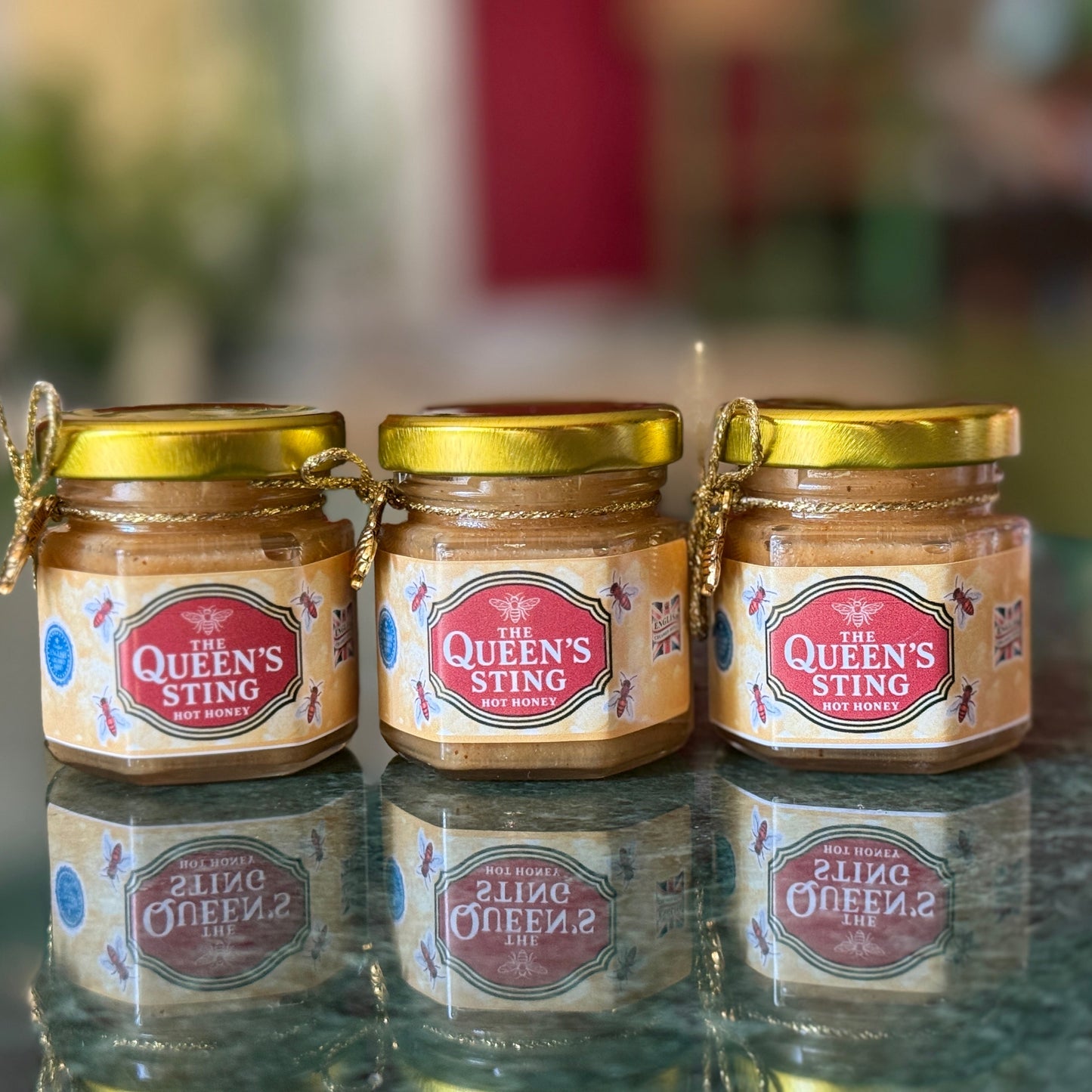 Close-up of spicy whipped honey texture in a glass jar with honey dipper