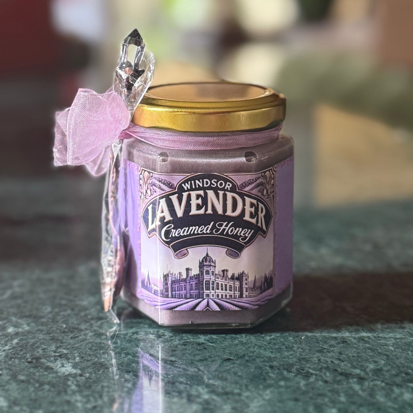 Lavender Creamed Honey in an elegant jar, showcasing the perfect blend of smooth, velvety honey with aromatic lavender. Made from 100% natural raw honey, this premium creamed honey adds a delicate floral sweetness to your favorite baked goods, teas, or cheese boards. The subtle lavender infusion offers a luxurious, soothing flavor that makes it an ideal gift for honey lovers or a sophisticated addition to any culinary creation. Experience the perfect balance of sweetness and floral notes with Lavender Cream