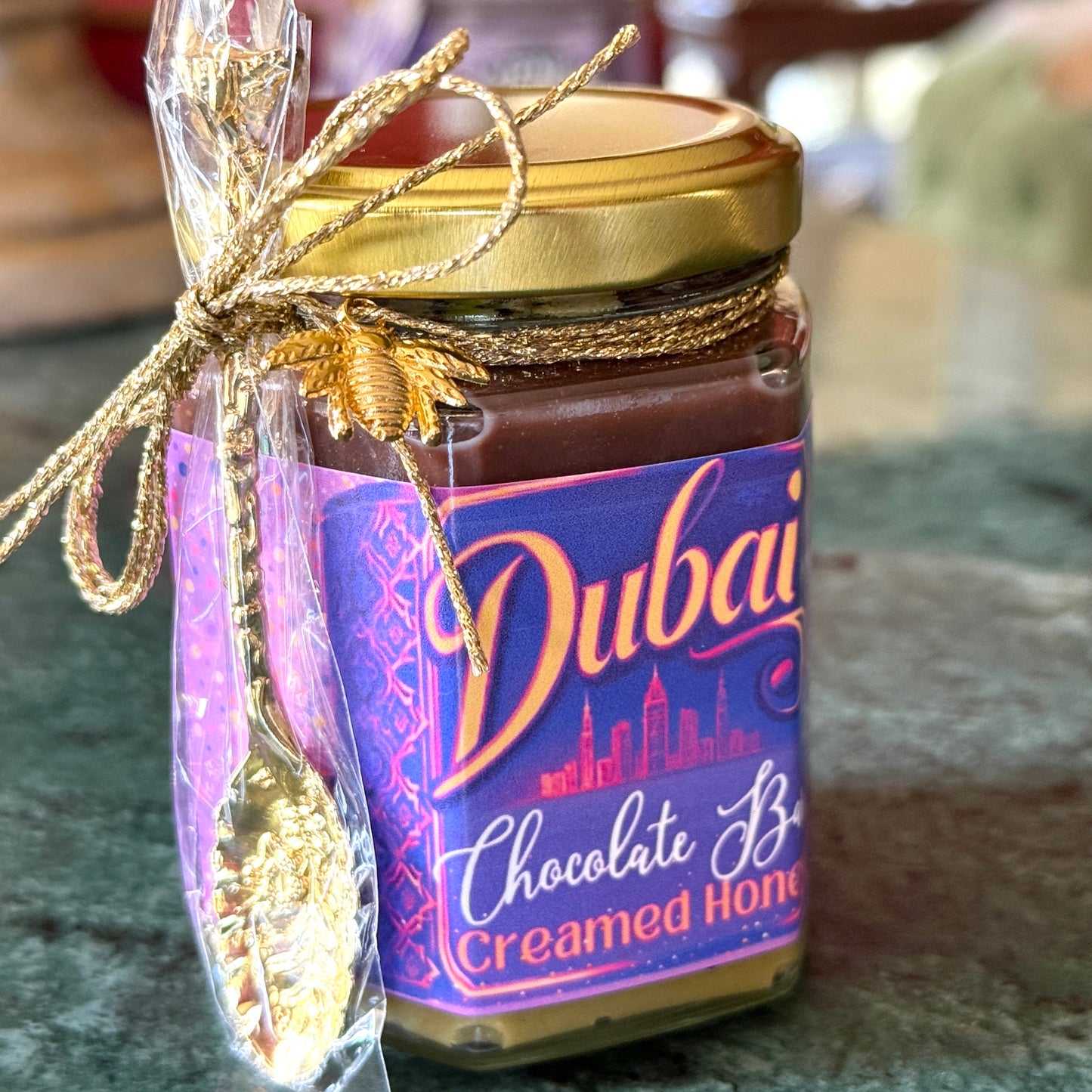 Dubai Chocolate Bar Creamed Honey with Pistachio Cream and Nutella Ganache Layer in a jar, showcasing a luxurious, nutty dessert spread.