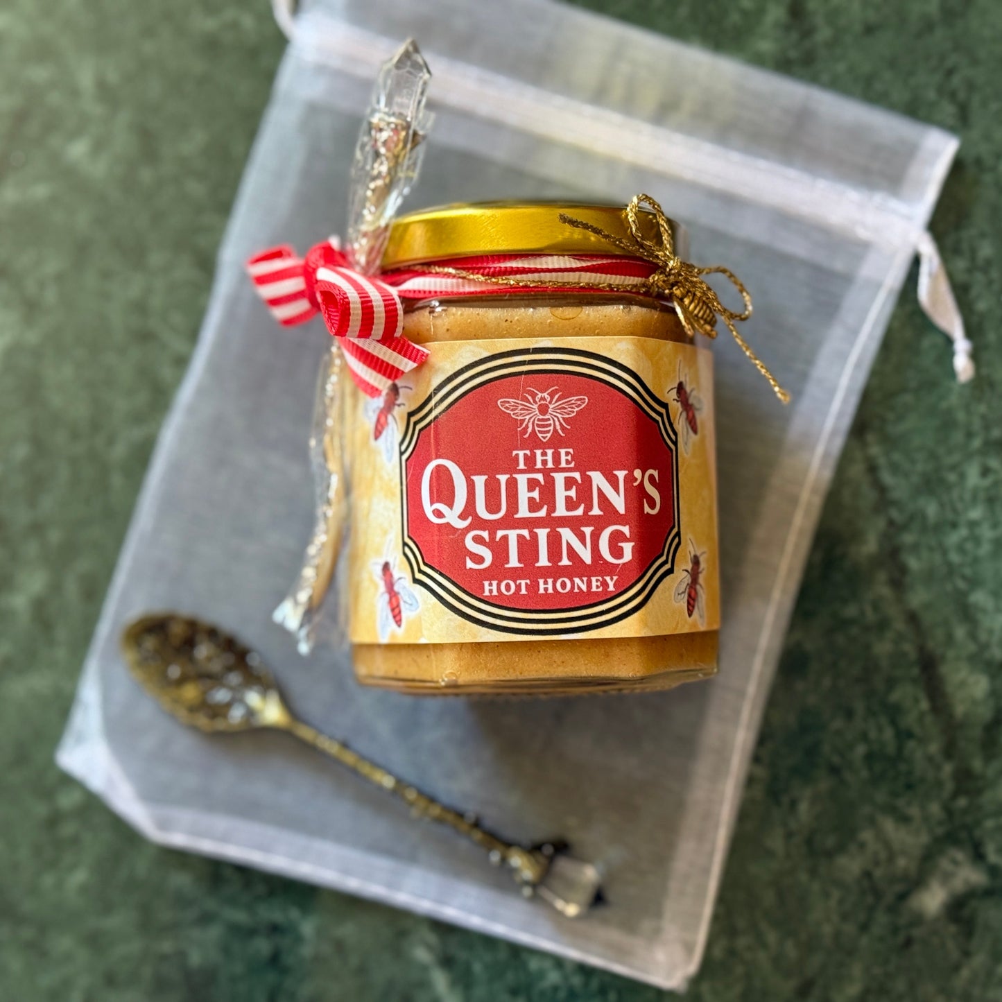 Spicy creamed hot honey jar in organza gift bag with gold spoon – ready-to-gift foodie treat