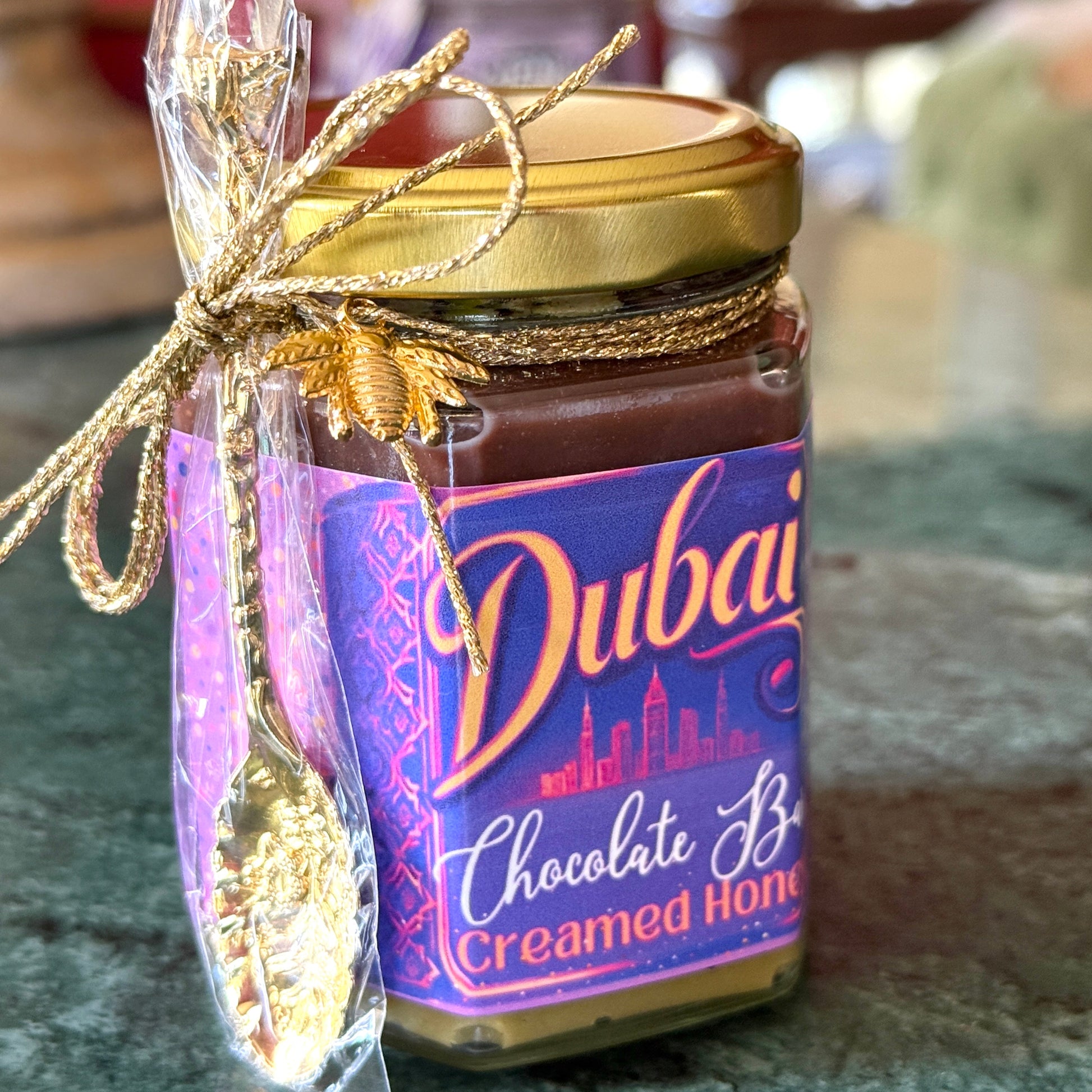 Dubai Chocolate Bar Creamed Honey with Pistachio Cream and Nutella Ganache Layer in a jar, showcasing a luxurious, nutty dessert spread.