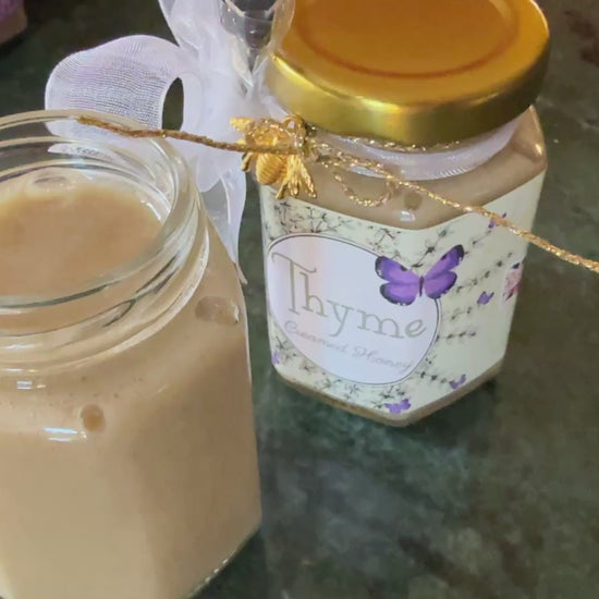 Video of a spoon dipping into Greek Organic Thyme Creamed Honey – showcasing its smooth, velvety texture and rich herbal infusion from wild Greek thyme. Perfect for gourmet food lovers, cheese boards, and Mediterranean-inspired dishes. #CreamedHoney #GreekHoney #ThymeHoney #HoneyDrizzle #GourmetHoney #SavoryHoney #OrganicHoney #HoneySpoon #FlavoredHoney #FoodieVideo #HoneyTexture