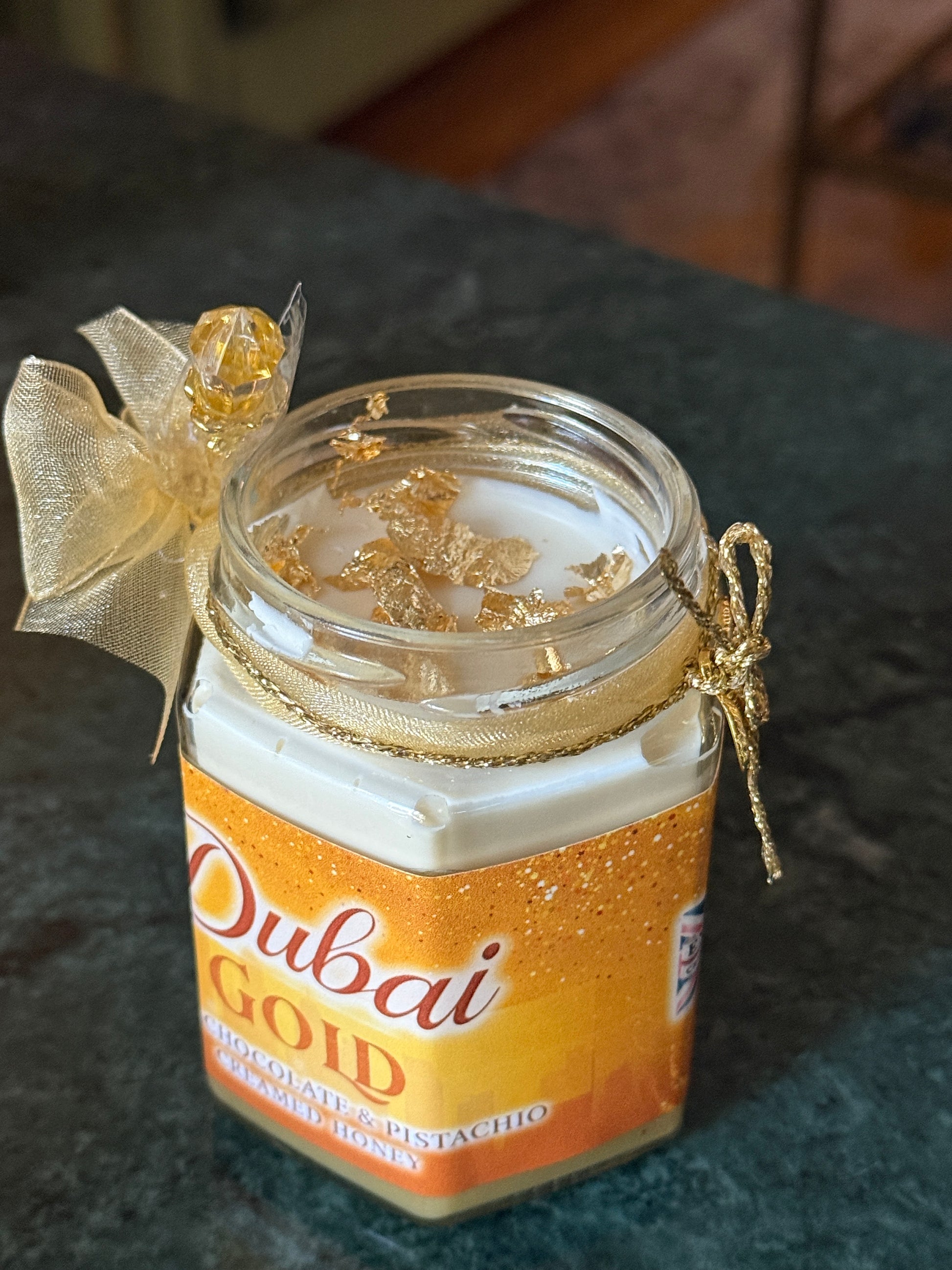 Gourmet Creamed Honey gift box featuring Dubai Chocolate Bar Gold Edition with pistachio, white chocolate ganache, and edible gold leaf
